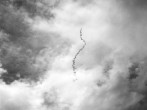Hicham Berrada, Un serpent dans le ciel, 2008, Balloon, 1 m³ of helium, brass pendulum system, artisanal smoke, fuse Video HD Black & White, 1’40’’. Image courtesy of Hichal Berrada and Kamel Mennour.